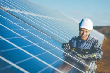 Person installing solar panels