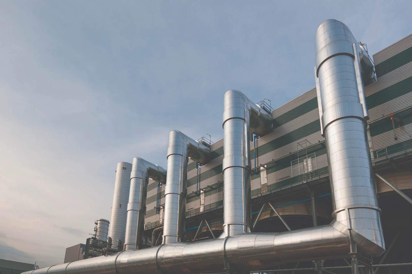 Image of pipes used for district heating on the outside of a building