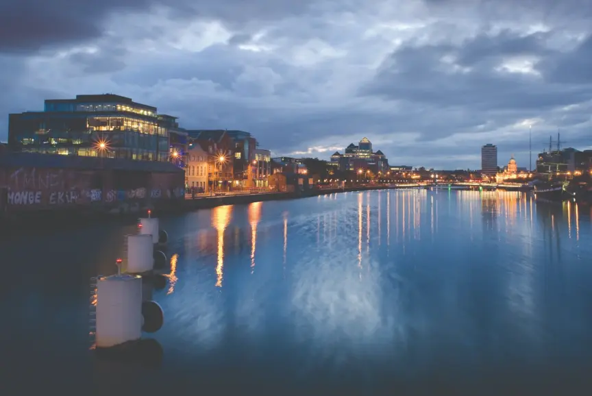 Image of buildings lit up along the River Liffey