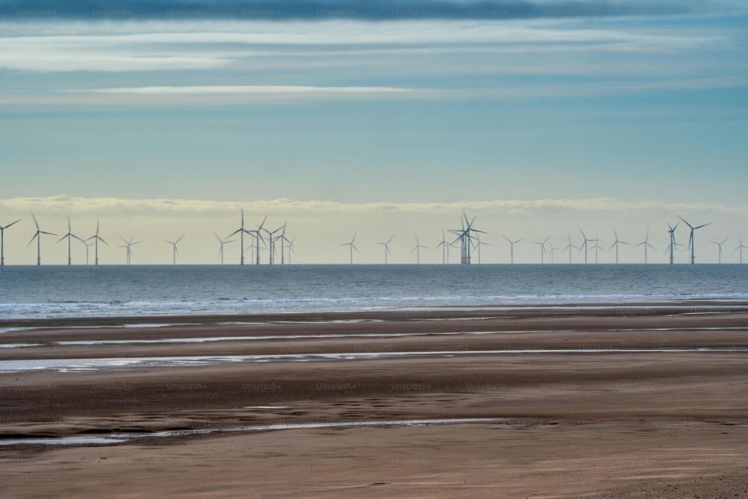 Image of a coastline with an offshore windfarm