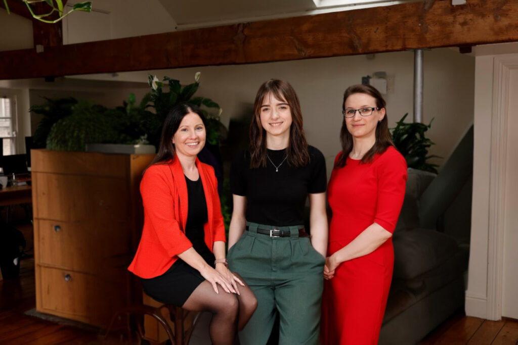 Communications and Marketing team - three women facing the camera